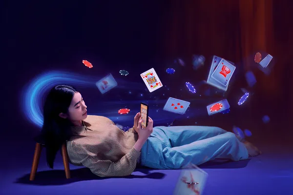 A young woman relaxing with her phone while dynamic casino elements float around her, illustrating the smooth mobile experience offered by the 26JLPH app.
